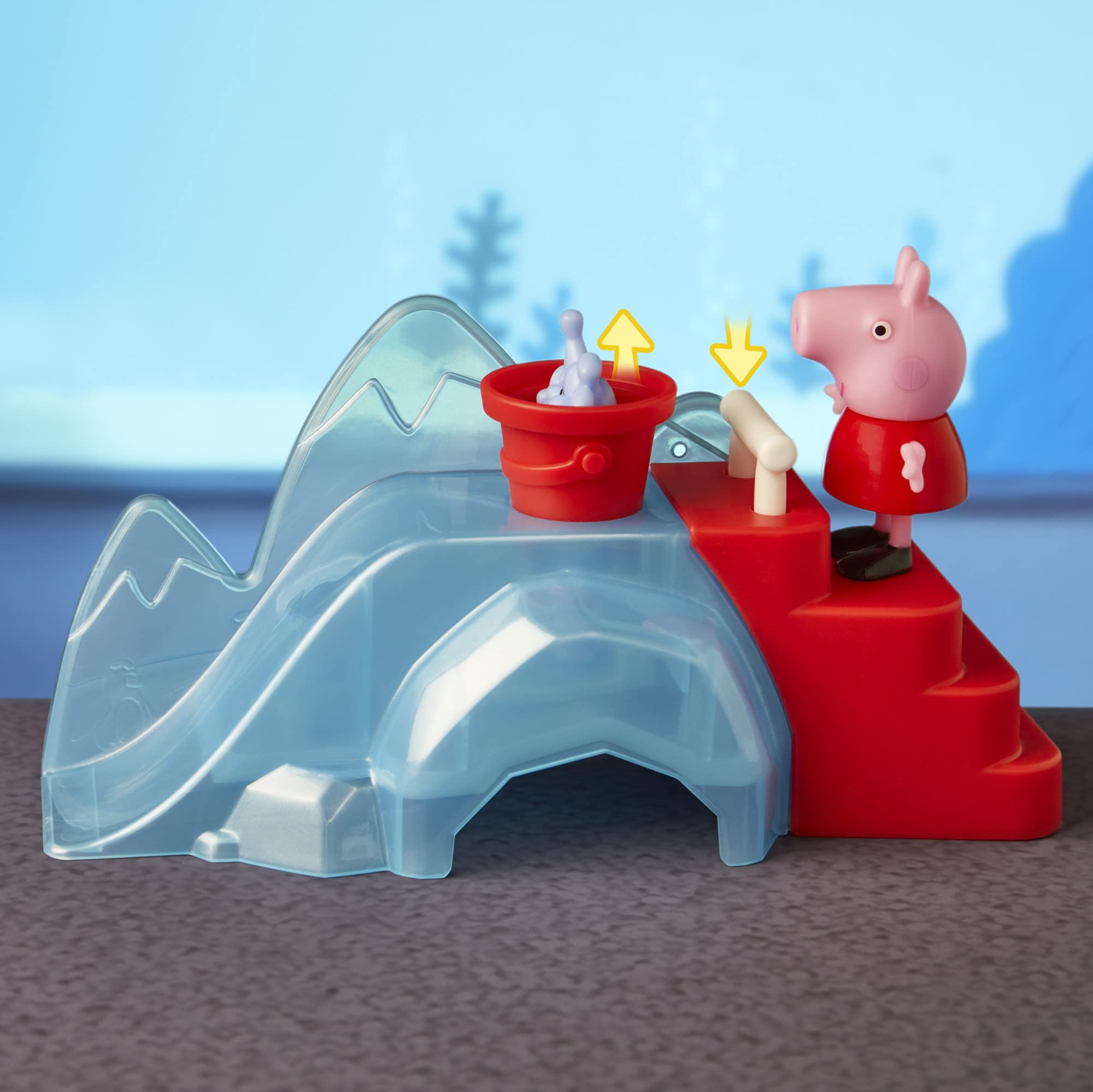 Peppa Pig penguin figures near the ice slide in the aquarium adventure.