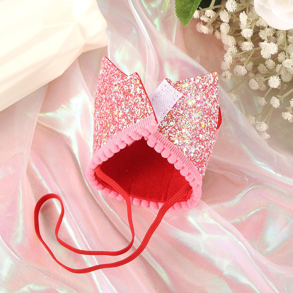 PEUTIER strawberry 1st birthday hat used as a gentle photo prop for greetings.