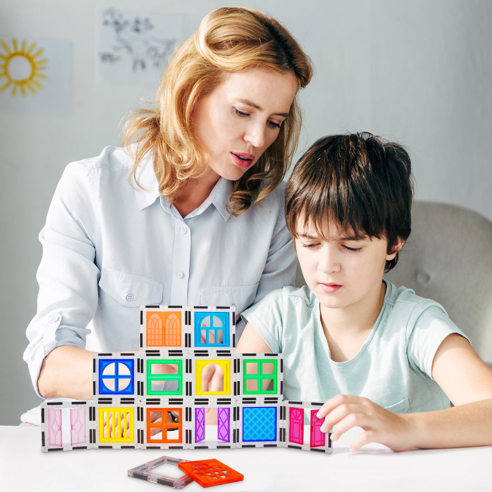 PicassoTiles door clip-on inserts enable operable entryways in kid-built structures.