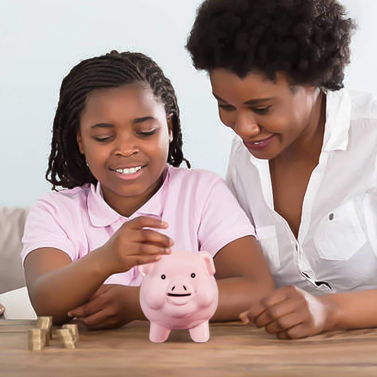 PIG WORLD ceramic piggy bank measures 6x6x4 inches on desk