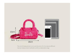 Pink Doll bag with strap and handle offers versatile wearing options