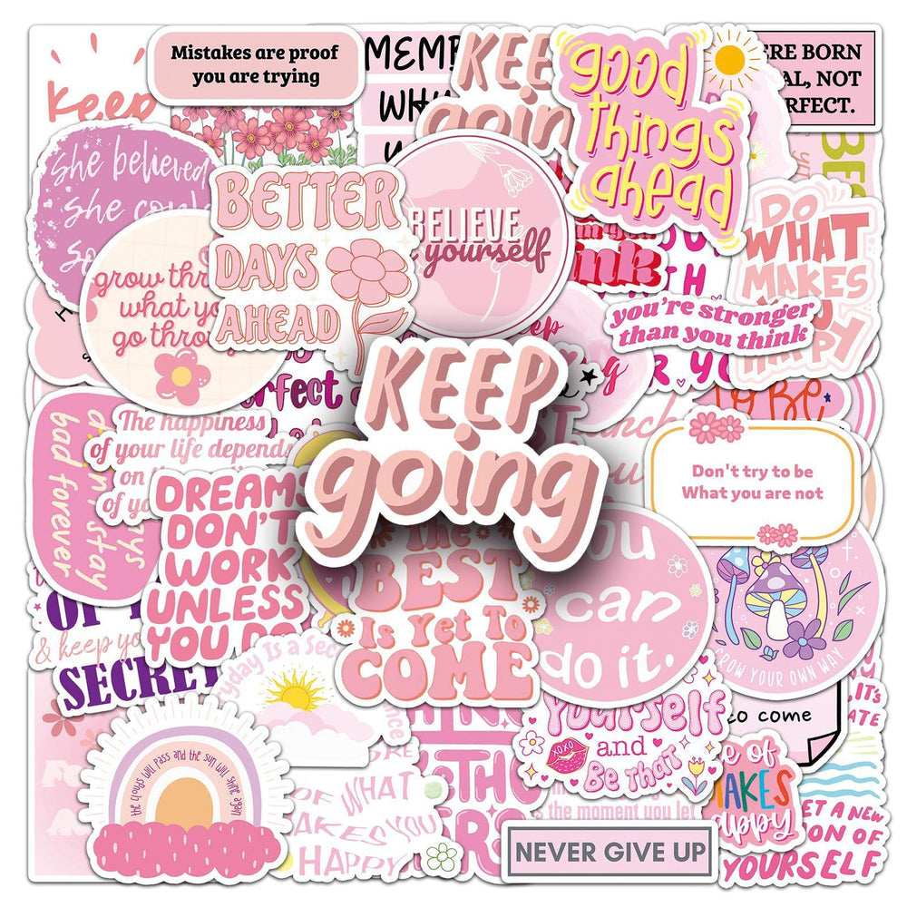 Pink motivational stickers on a journal for positive reminders