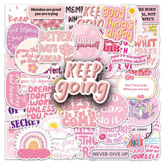 Pink motivational stickers on a journal for positive reminders