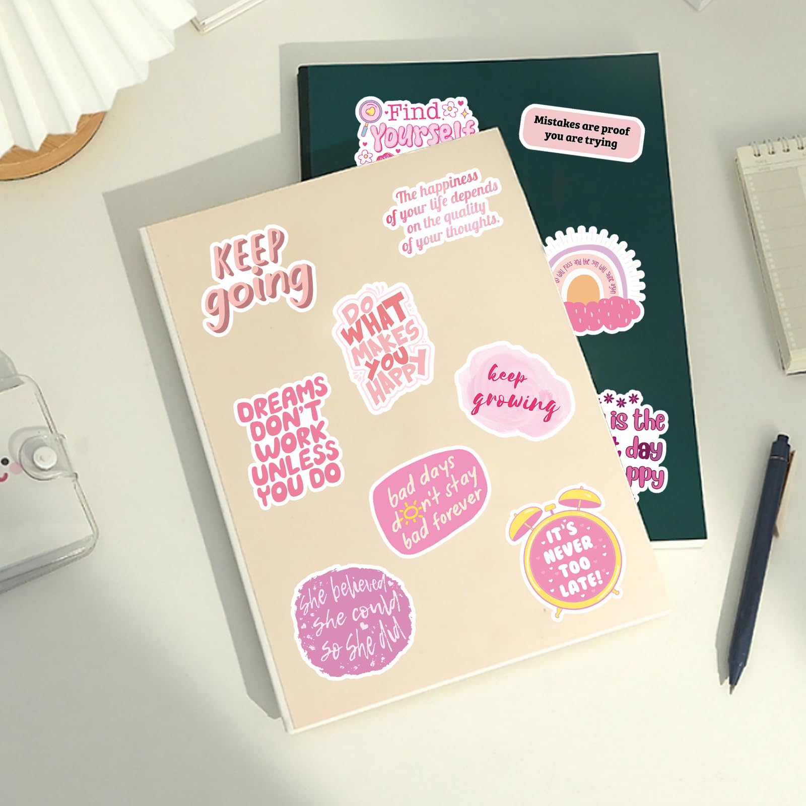 Pink motivational stickers on a phone case for uplifting notes