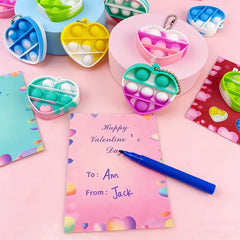 Pinkiwine heart pop toy close-up highlighting sensory click feature