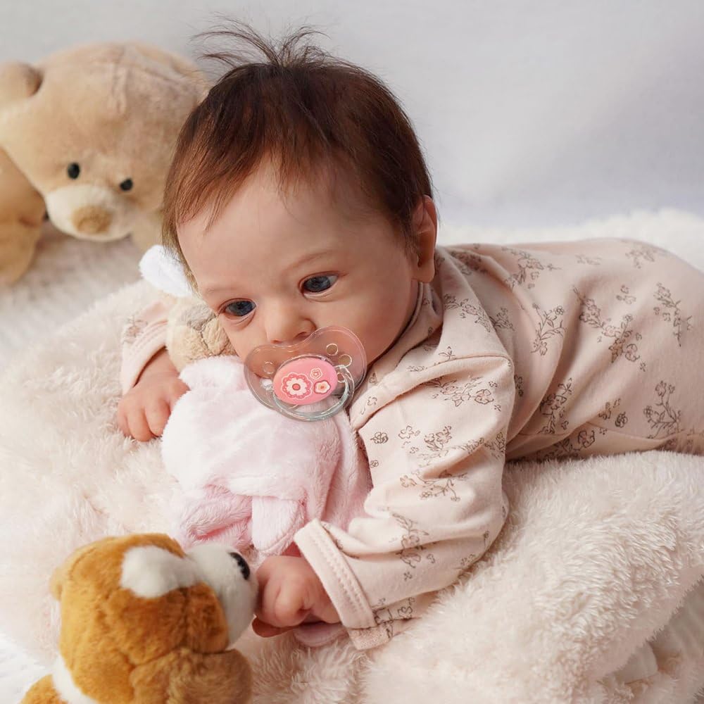 Pinky Reborn includes magnetic pacifier and milk bottle for nurturing play.