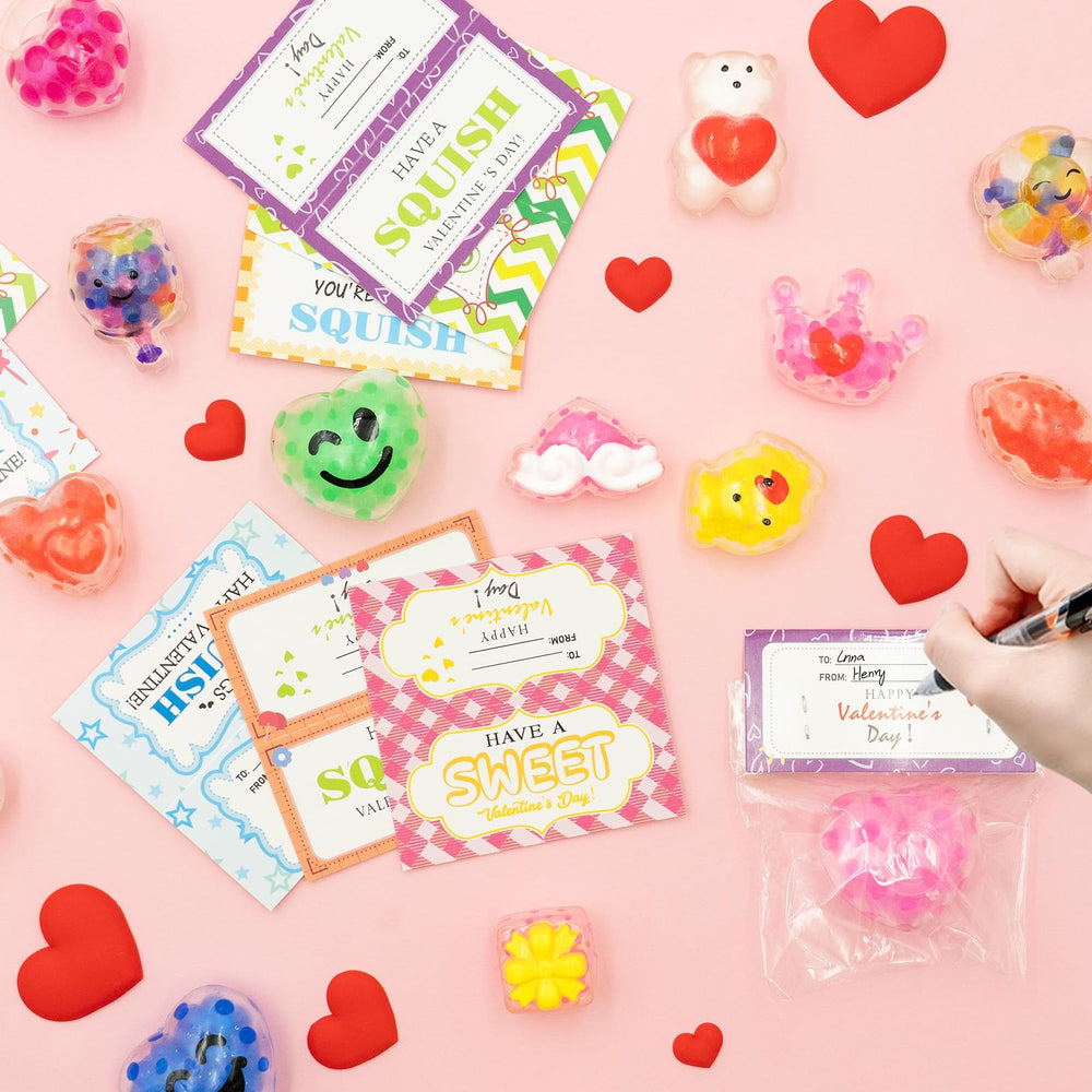 Clear treat bags with cards and stress balls ready for gifting.
