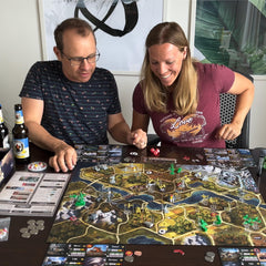 PKB Games Aces & Armor game night setup shows 1-4 players in action.
