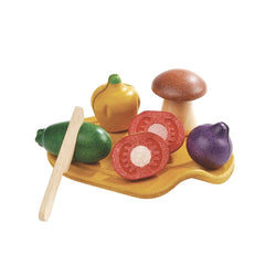 PlanToys wooden assorted vegetables on a tray with knife for imaginative cooking play.