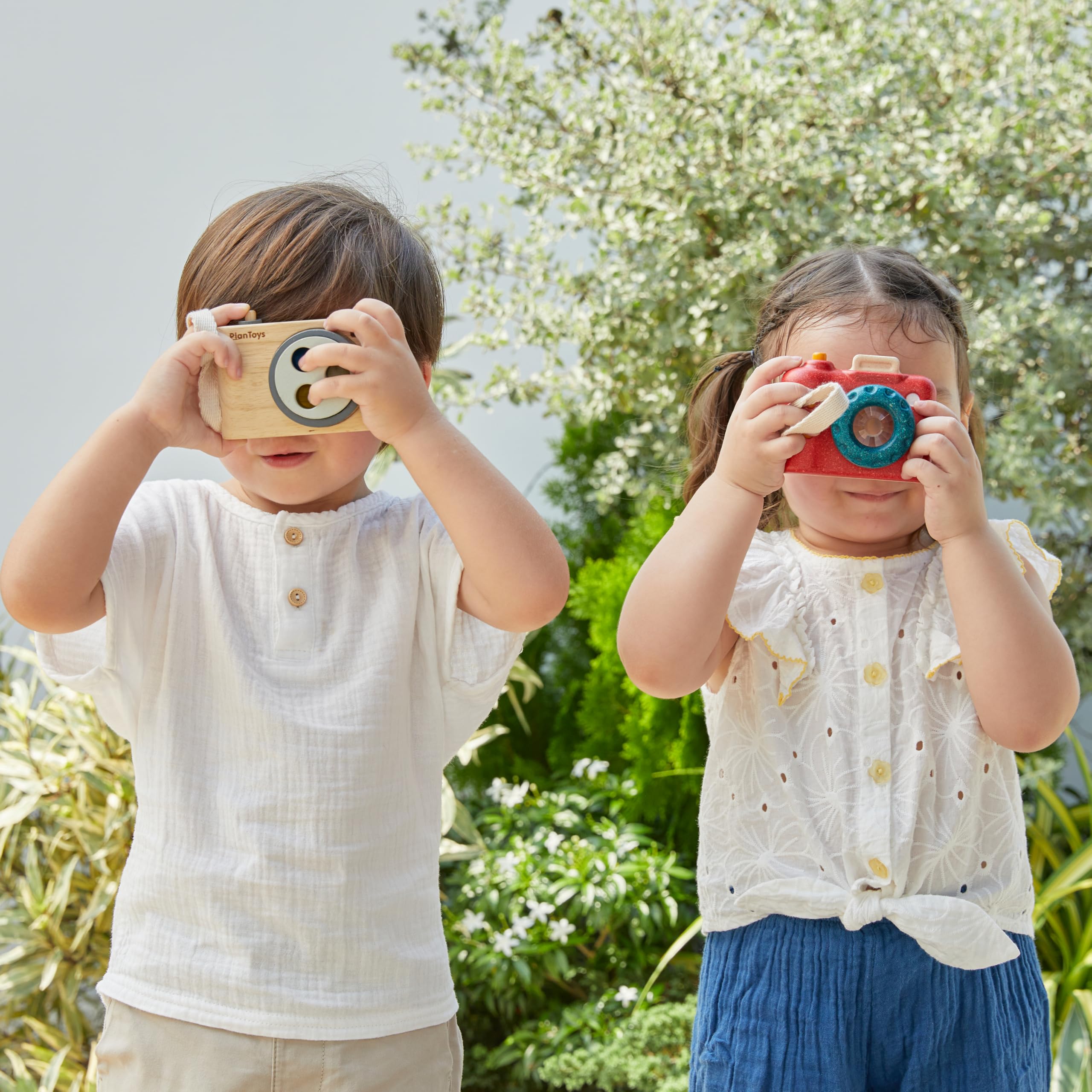 PlanToys wooden camera promotes role-playing as wildlife photographer or reporter.