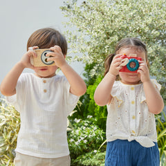 PlanToys wooden camera promotes role-playing as wildlife photographer or reporter.