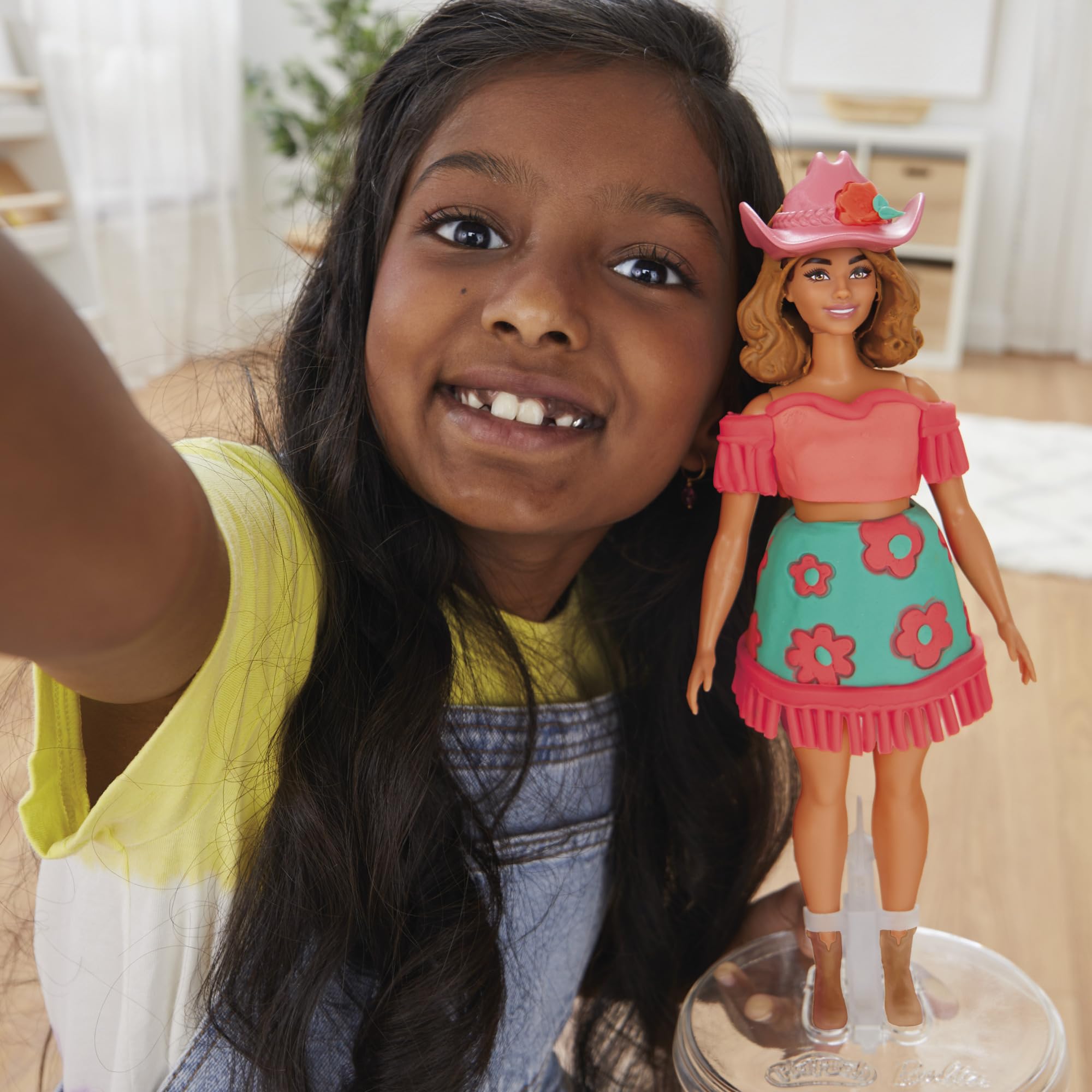 Boots accessory adds final touches to Barbie's country-style ensemble.