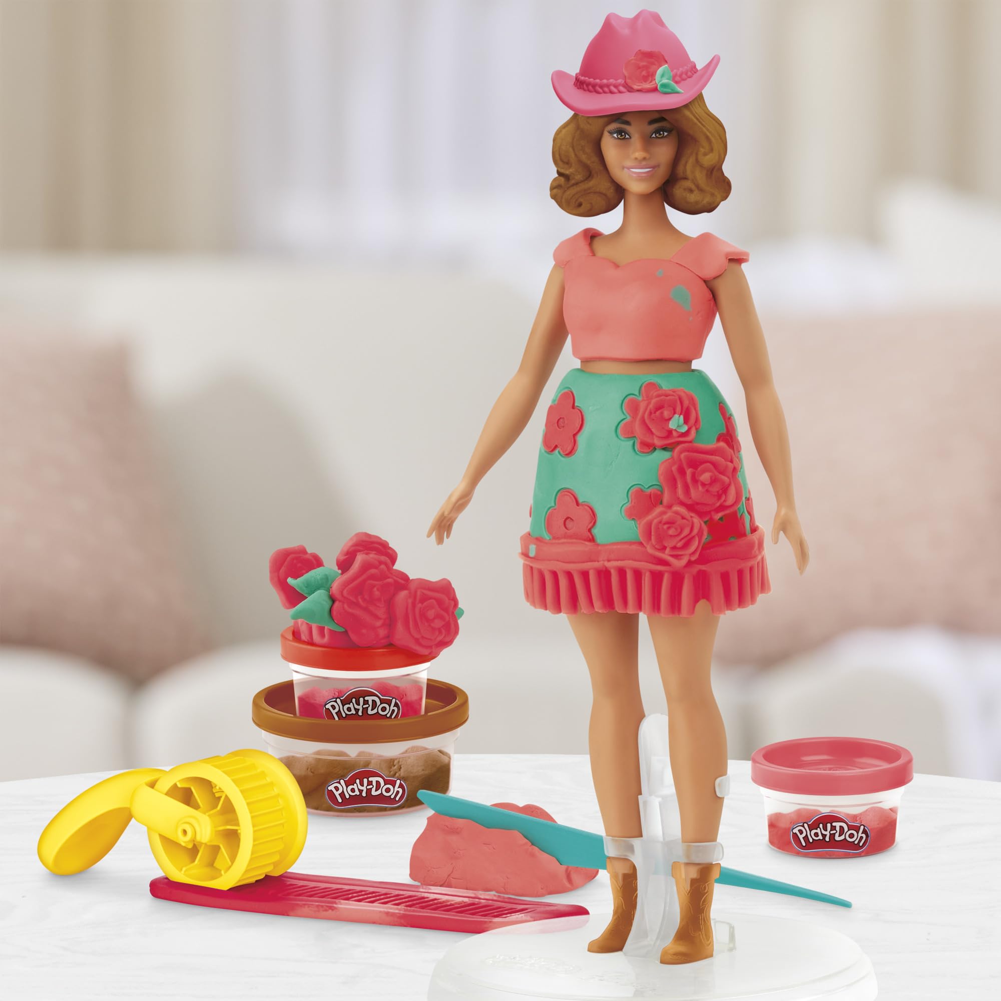 Barbie dress-up scene shows colorful, customizable fashion designs.