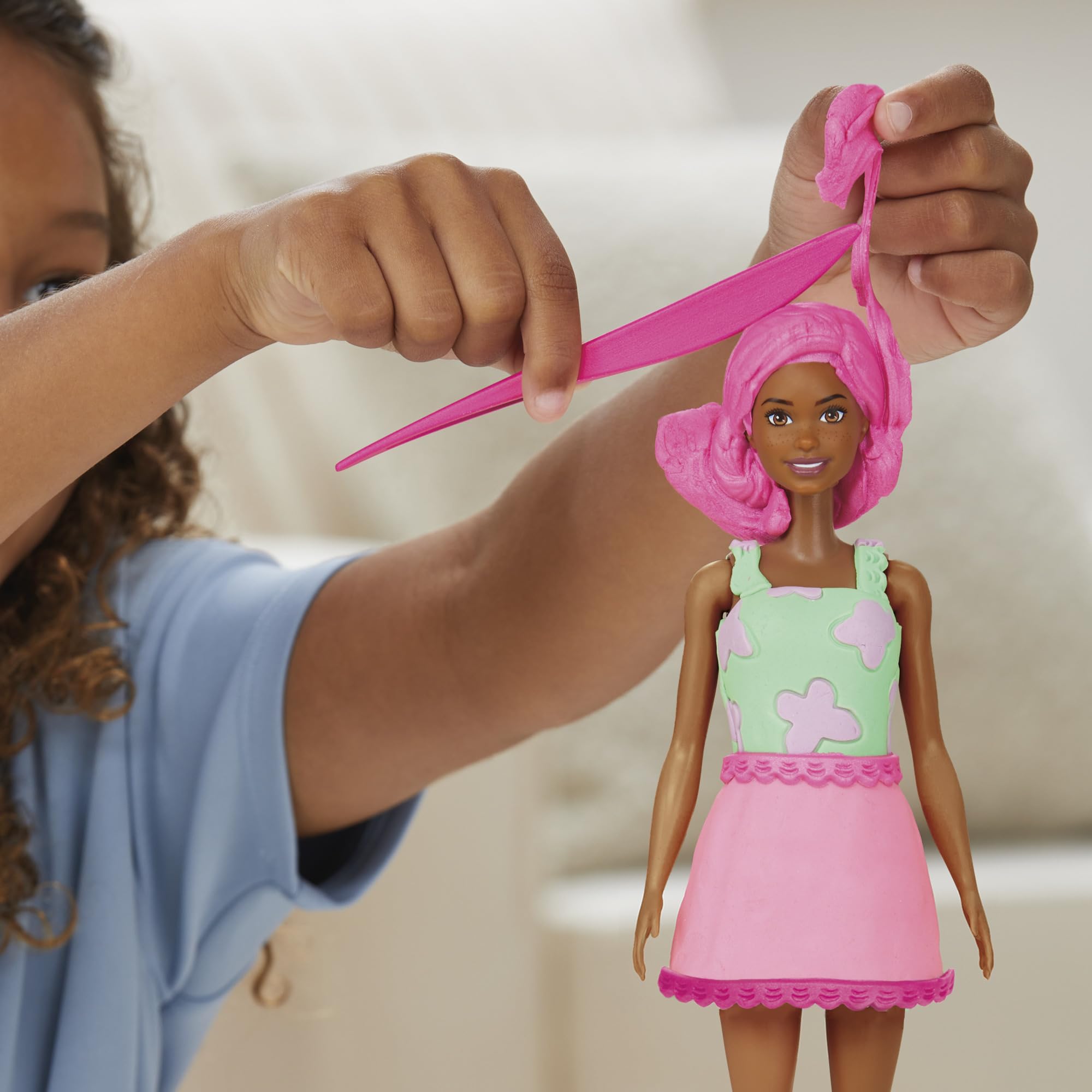 Play-Doh Barbie Garden Party encourages imaginative fashion play.