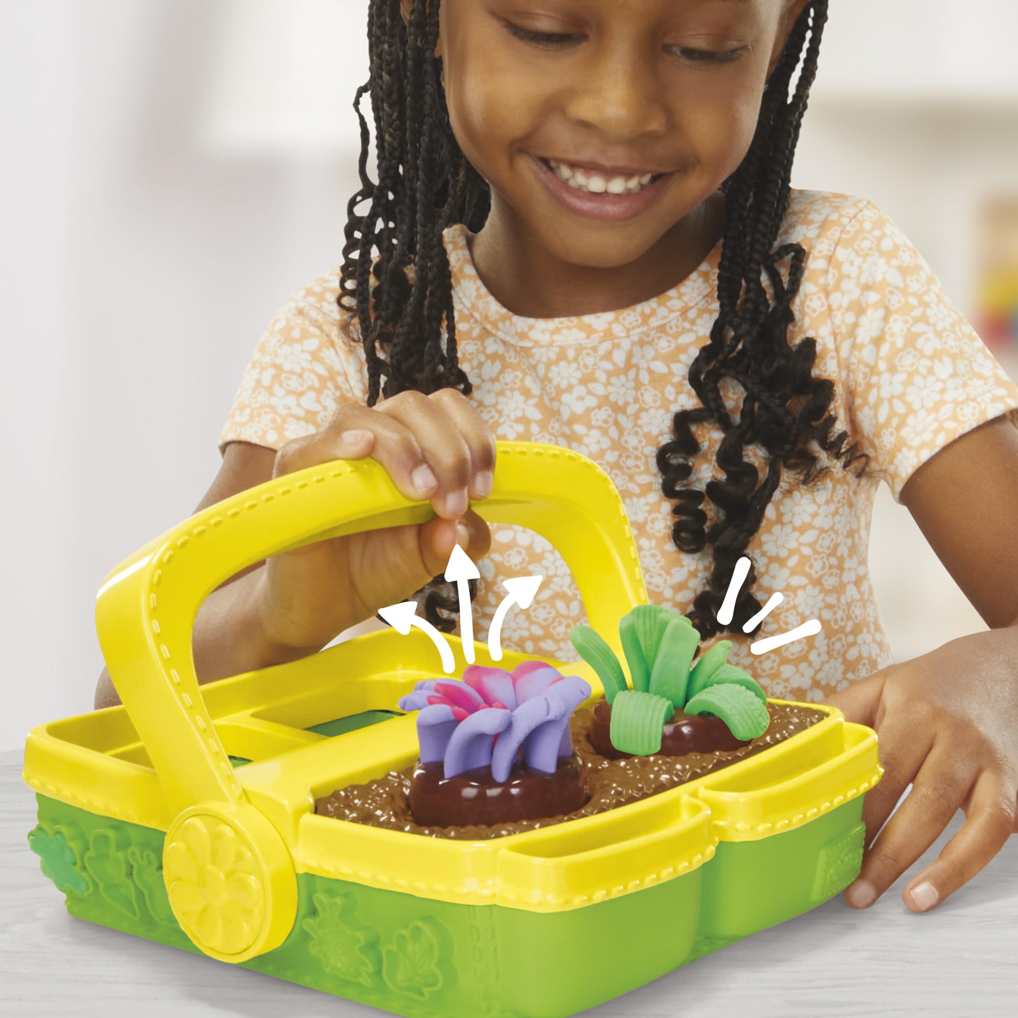 Play-Doh Blooming Flowers garden box doubles as storage for tools.