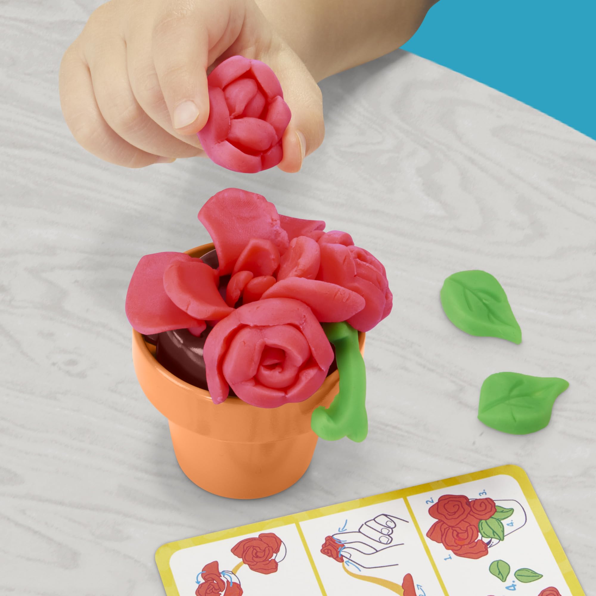 Play-Doh Blooming Flowers dual-color cans enable layered petals and vibrant designs.