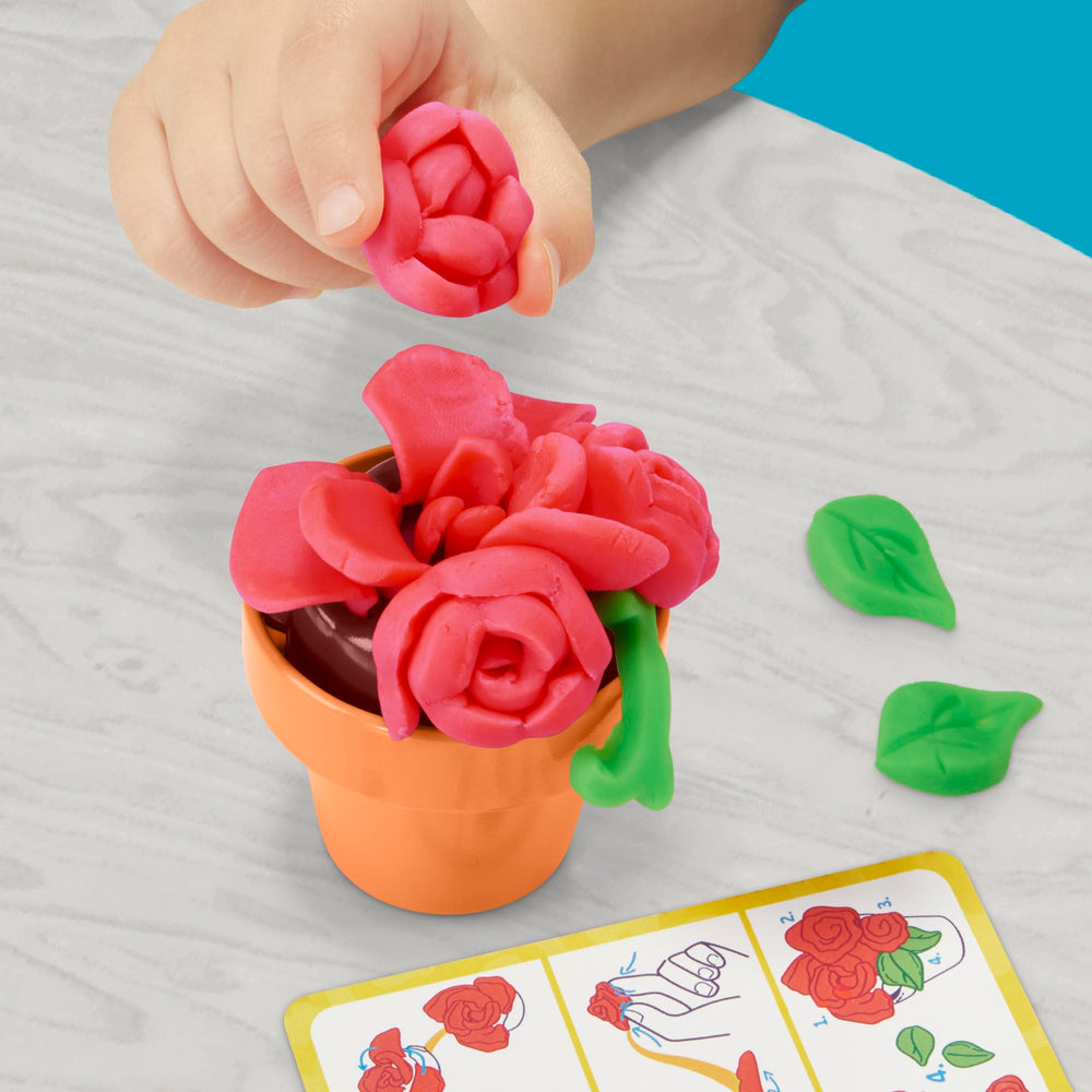 Play-Doh Blooming Flowers dual-color cans enable layered petals and vibrant designs.