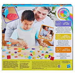 Child using Play-Doh Fundamentals stampers to form letters during learning activity