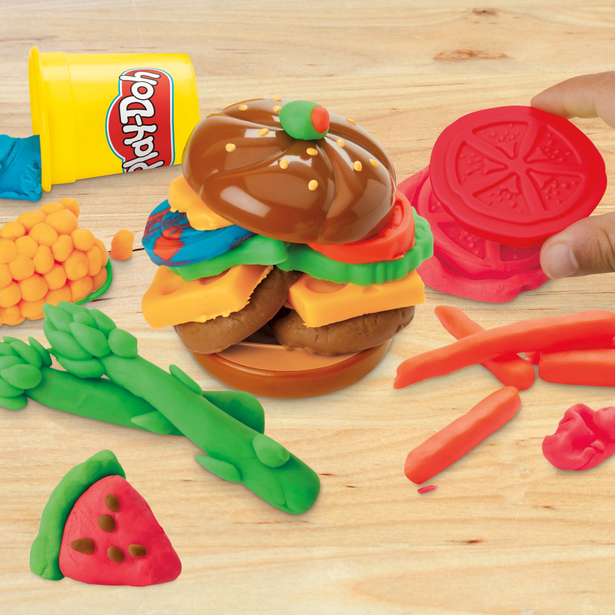 Play-Doh Grill Fun color cans showcase six vibrant dough colors for creative meals