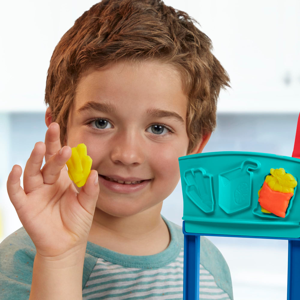 Play-Doh Kitchen Creations Busy Chef's Restaurant playset includes color packs for realistic dishes