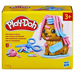 Play-Doh Mini Groom 'n Vet Set puppy on grooming base for pretend grooming.