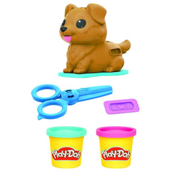 Puppy fur being pressed to create colorful Play-Doh textures.