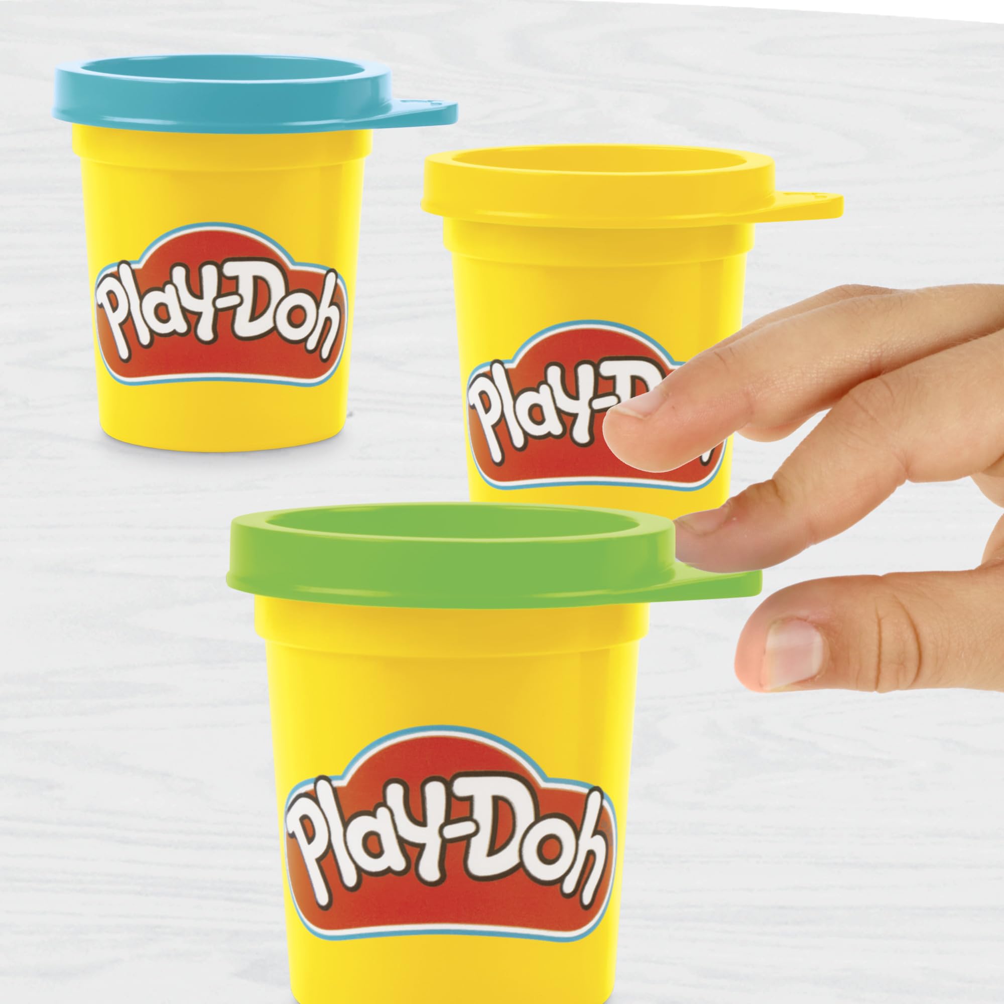 Play-Doh On-the-Go Garage packaging highlights portable storage for travel play.