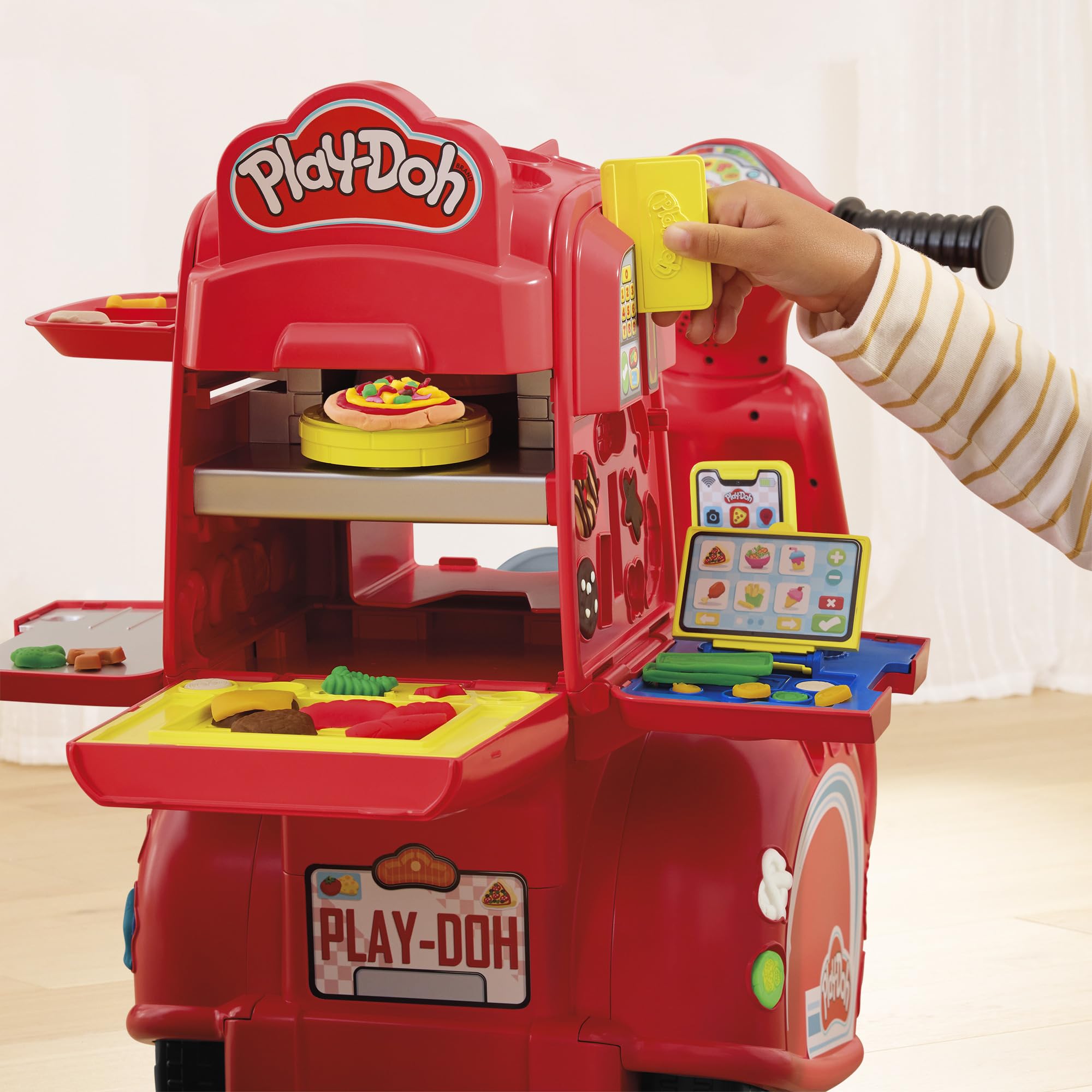 Play-Doh Pizza Delivery Scooter oven stamp and spin action in use