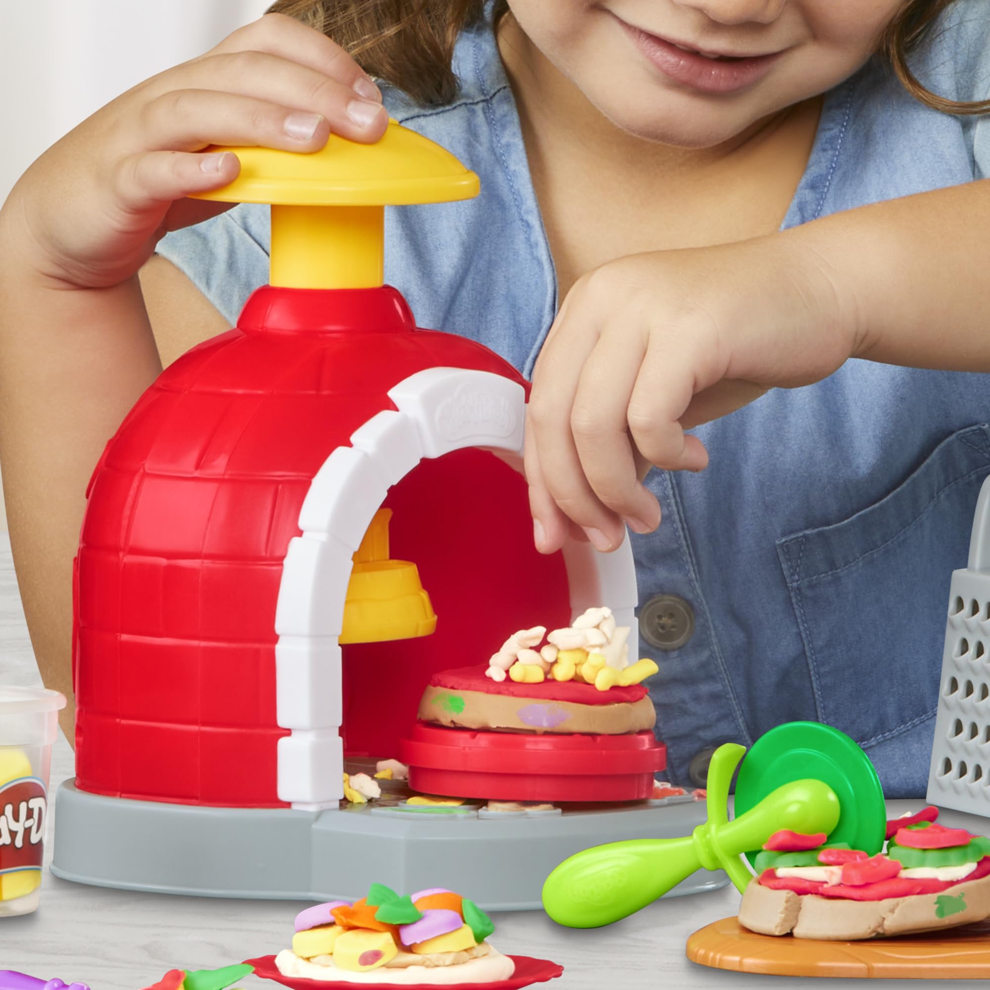 Play-Doh plates and utensils complete the pretend dining setup