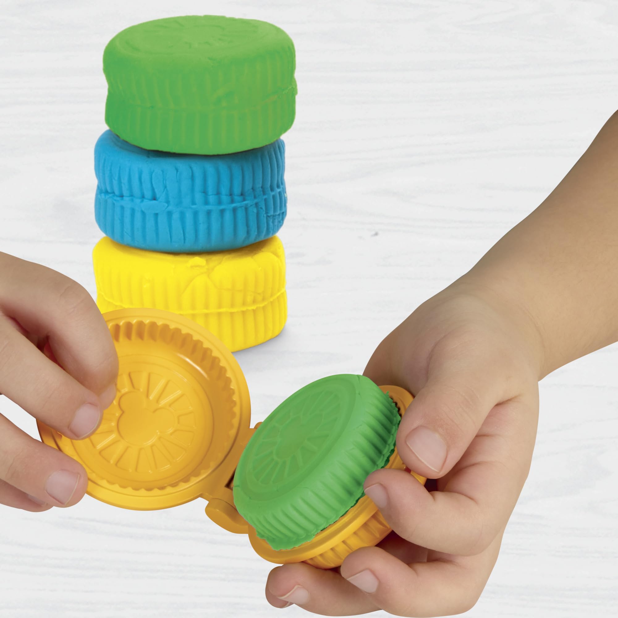 Play-Doh storage caddy with fold-out space keeps toys organized on the go.