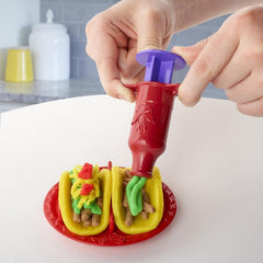 Play-Doh Taco Time taco plate holds two pretend tacos for easy meals.