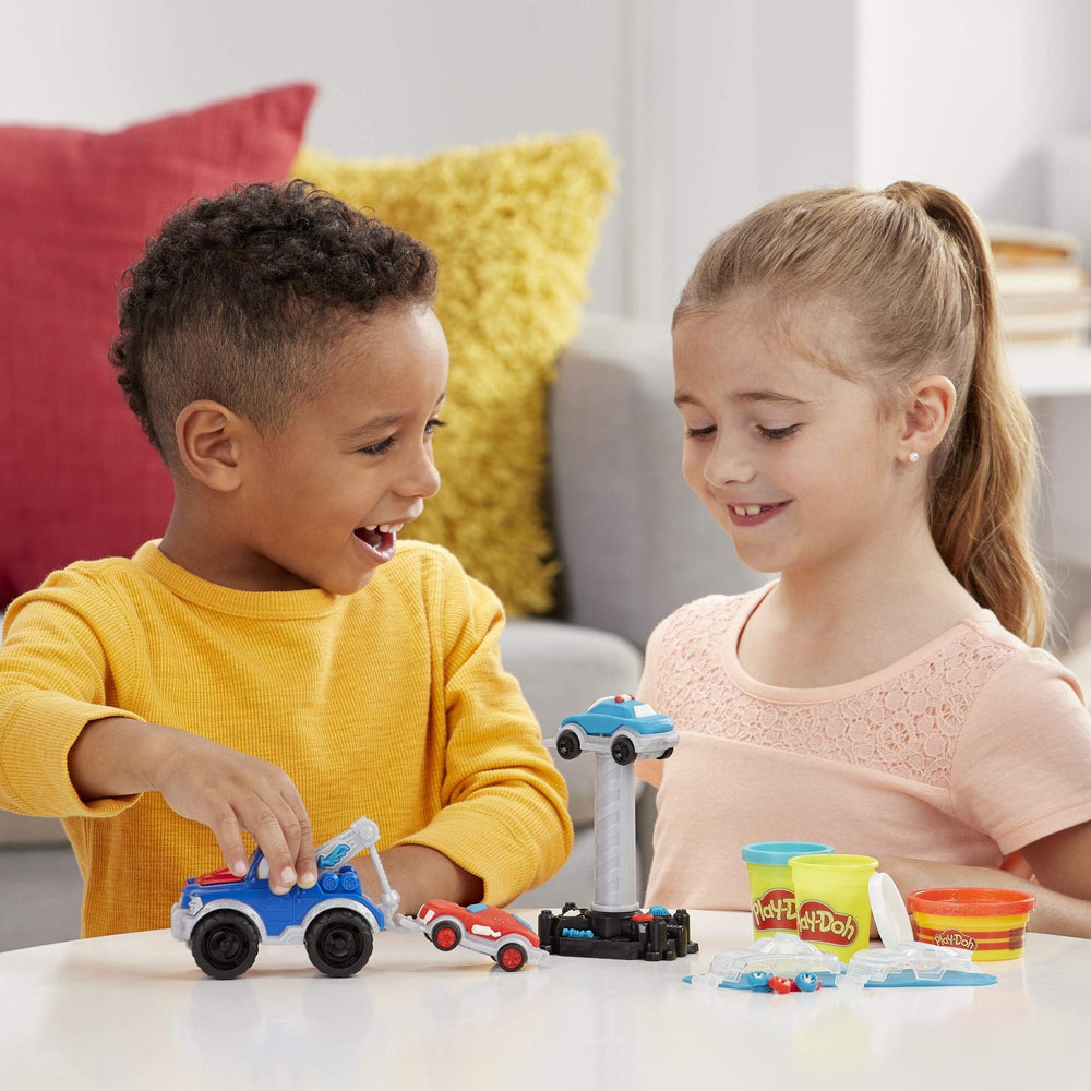 Play-Doh Wheels city play scene shows pretend vehicle action.