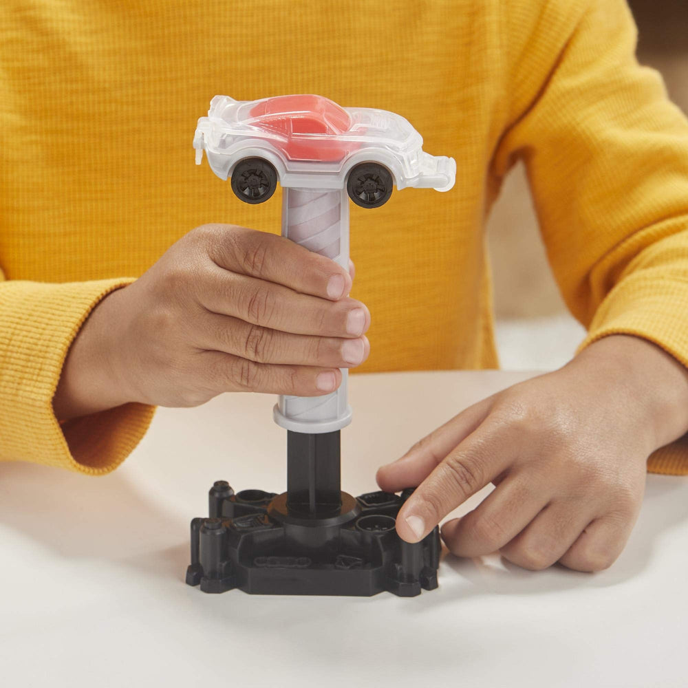 Play-Doh Wheels Tow Truck molds display area for quick car creations.