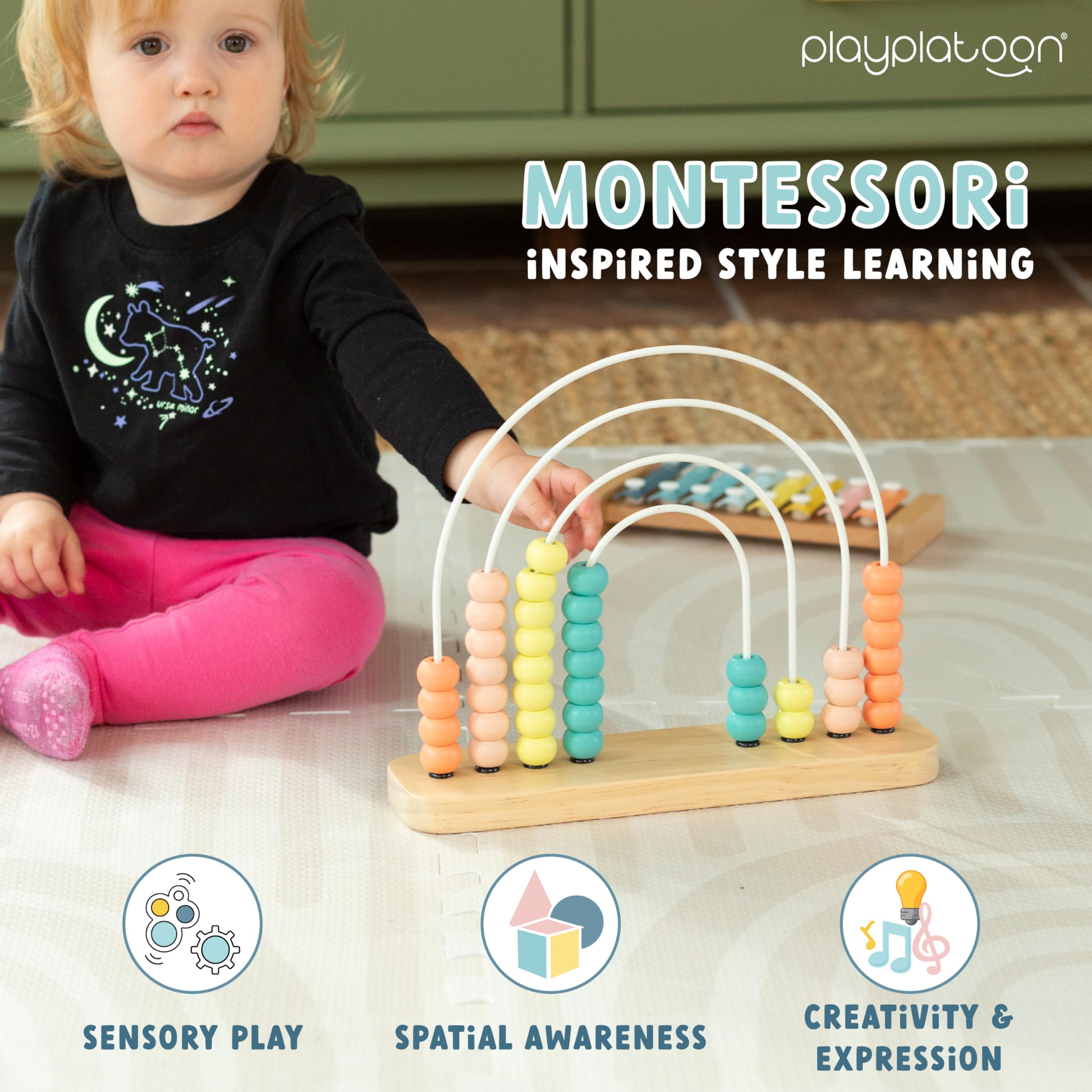 Neutral boho rainbow nursery decor with Play Platoon educational toy