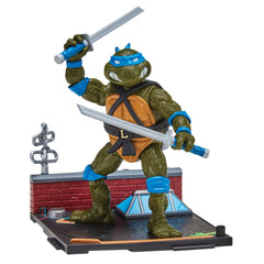 Playmates Toys Leonardo remastered figure in a dynamic pose for display.
