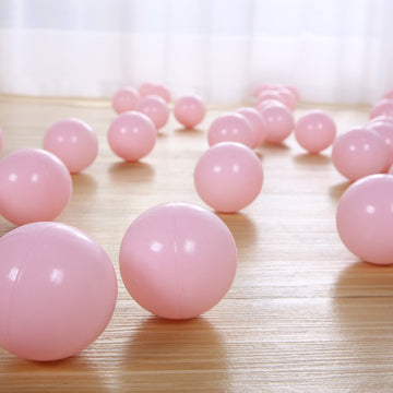 PlayMaty pink balls used as ball pool decor for a party.