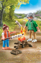 Playmobil 71513 figures near campfire for cooperative storytelling adventures.