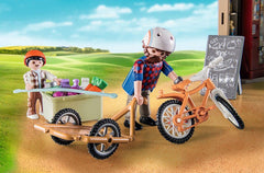 Playmobil Country Farm Shop child figures engaging in role play.