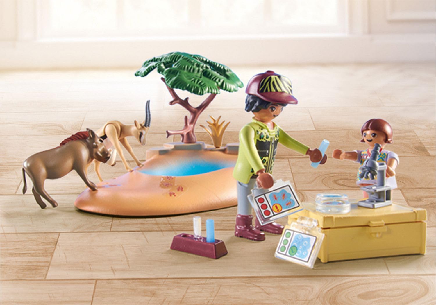 Playmobil elephant and two figures enjoy wilderness-themed roleplay
