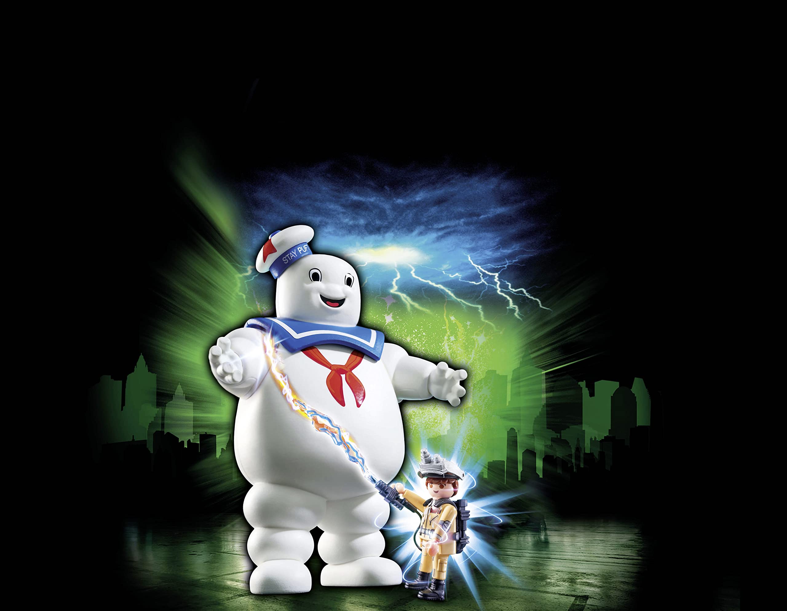 Playmobil Stay Puft towering over a marshmallow city scene for dramatic play.