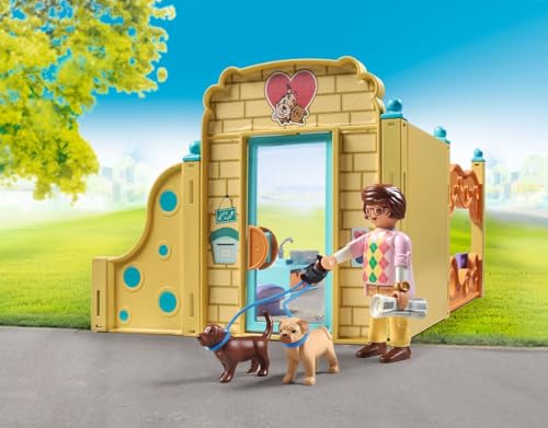 Playmobil Puppy Care Center caretaker figure guiding puppies through pretend grooming