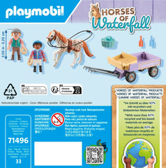 Two kids enjoy a pony ride on the carriage
