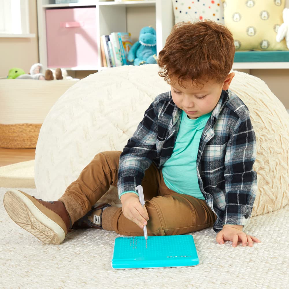 PlaySkool Magnatab closeup magnet movement highlights tactile feedback.