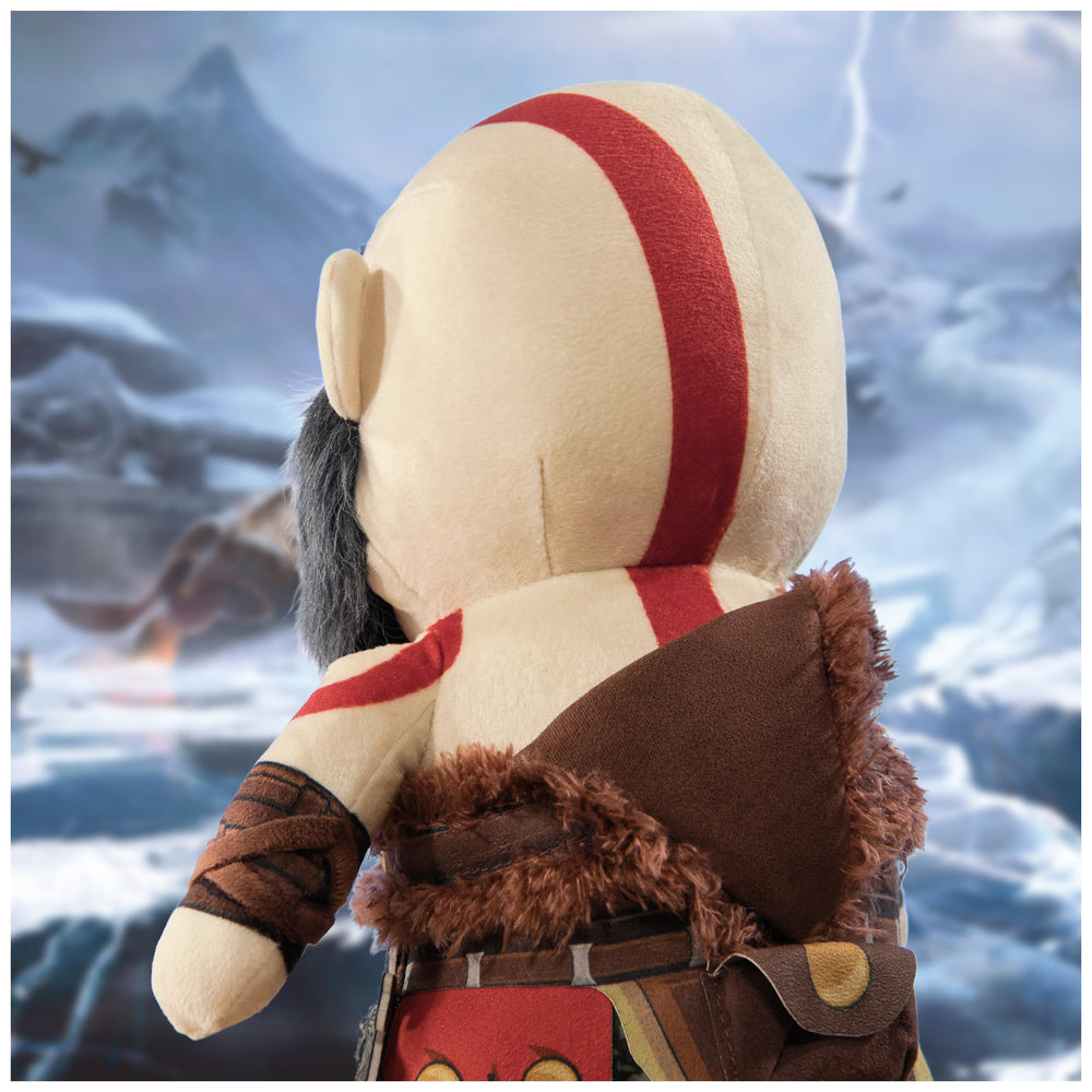 PlayStation Kratos plush placed on a shelf as a display piece.