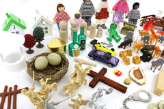 Mixed-material miniatures from PlayTherapySupply support tactile sensory exploration.