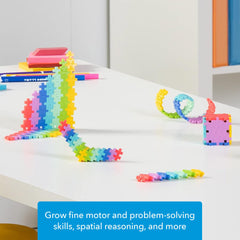PLUS PLUS building idea guidebook provides inspiration for projects.