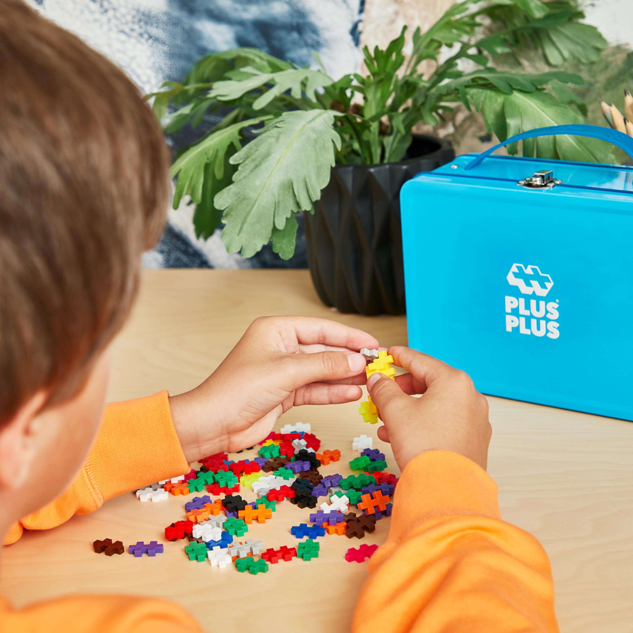 PLUS PLUS neon pieces add bright accents for eye-catching creations.