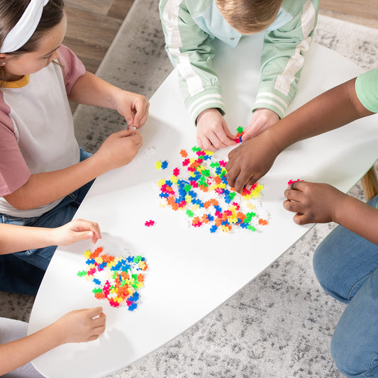 PLUS PLUS Neon mosaics inspire vibrant, tactile play that supports fine motor skills during learning.