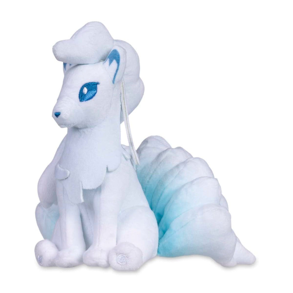 Pokémon Center Alolan Ninetales Sitting Cuties Plush upright on desk for cute decor.