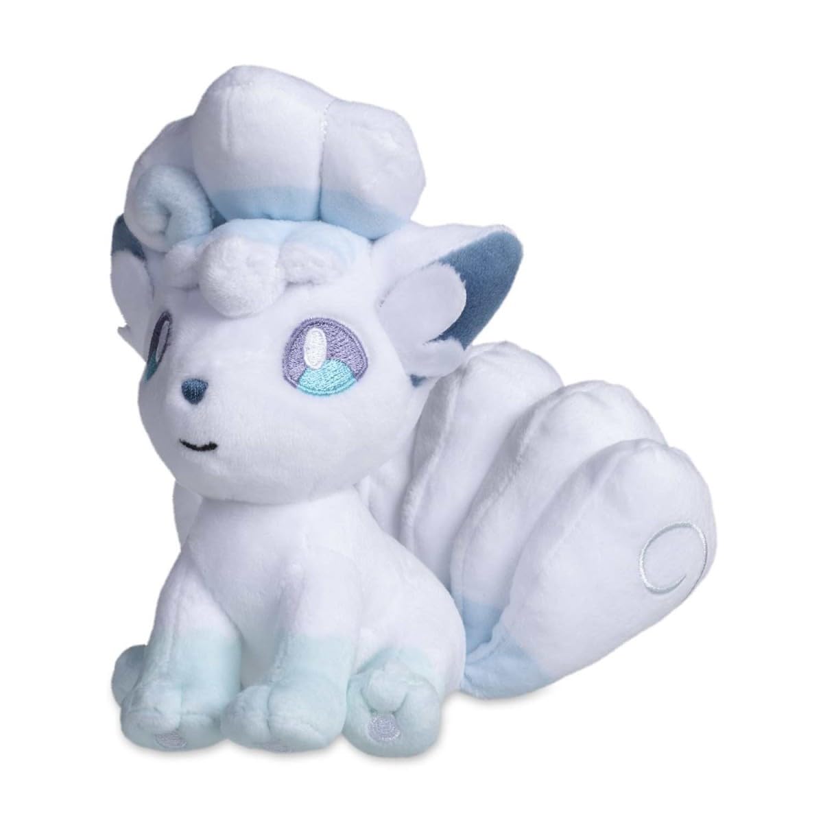 Pokémon Center Alolan Vulpix Sitting Cuties Plush sits upright on a desk or shelf.
